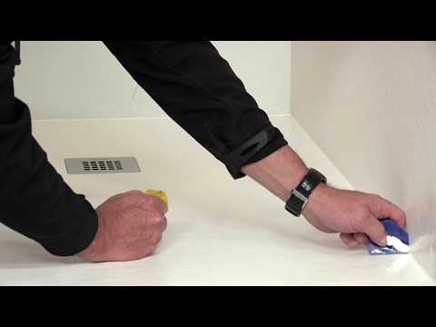 Installation of a shower tray onto a concrete base