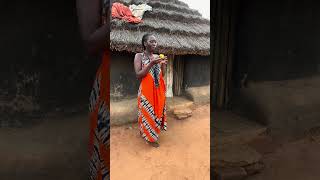 Enjoying a mango in the village