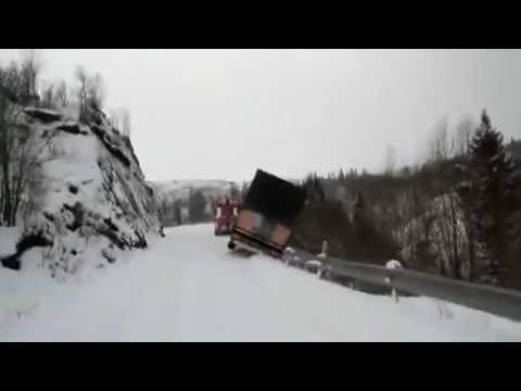Lorry and tow truck slide off snowy cliff in Norway