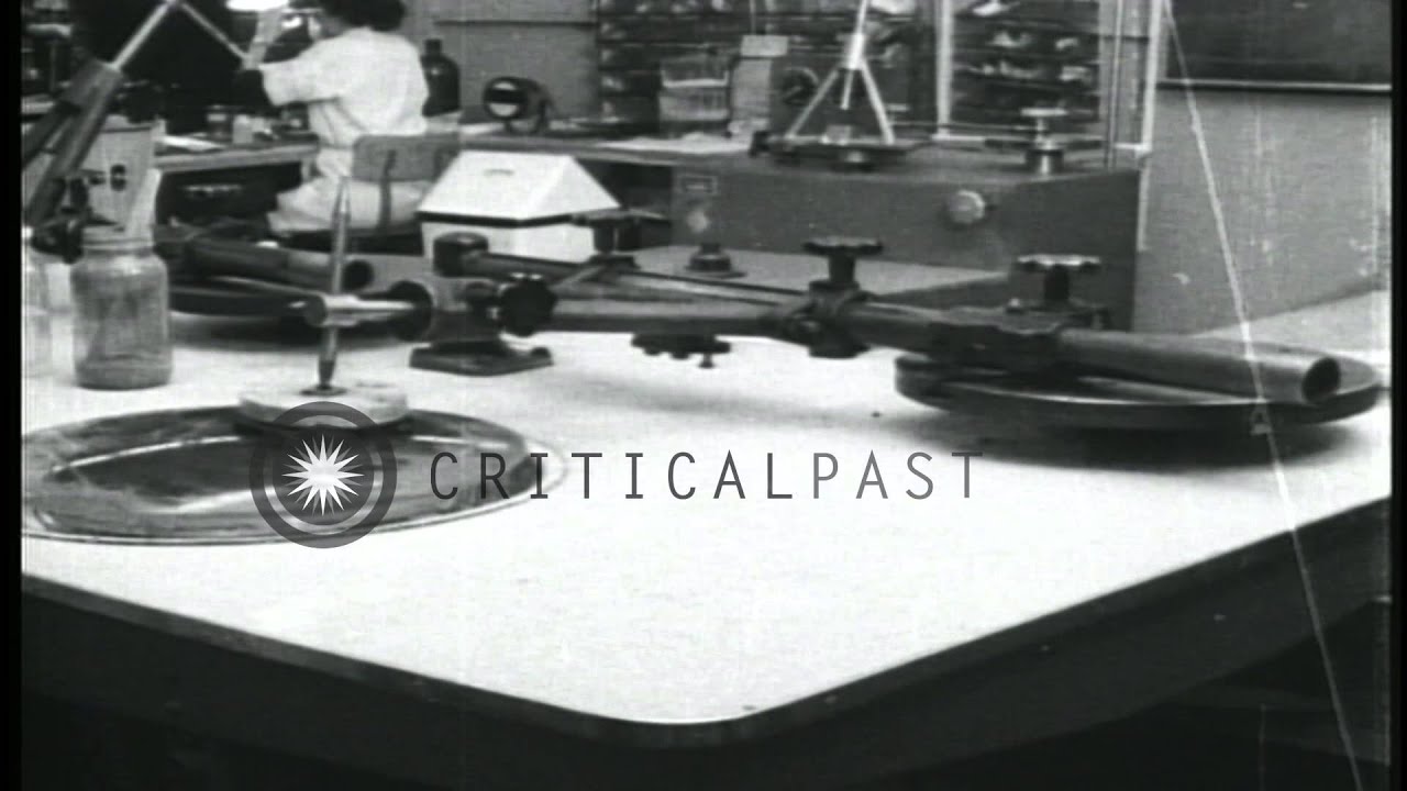 Precision grinding of glass lenses at Northrop Aircraft Company, Anaheim Division...HD Stock Footage