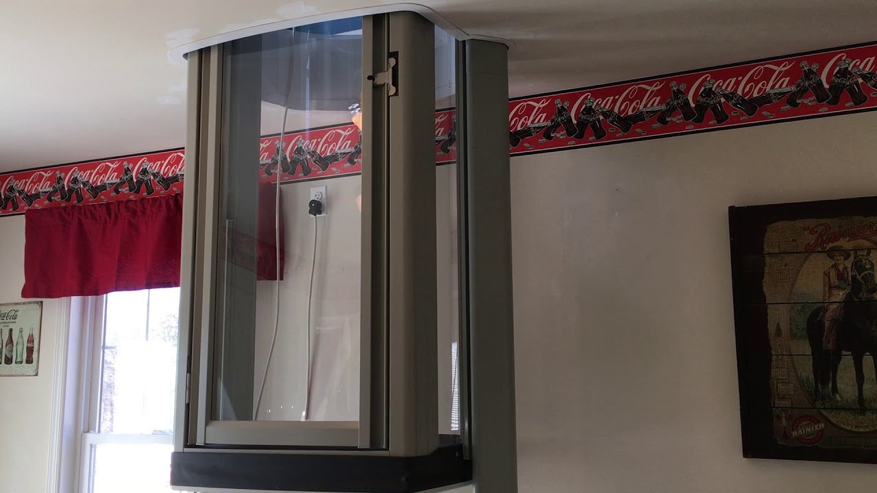 Through floor elevator traveling up | HomeElevators.com