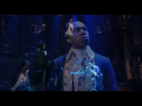 Hamilton trailer still of Alexander Hamilton and ensemble performing onstage