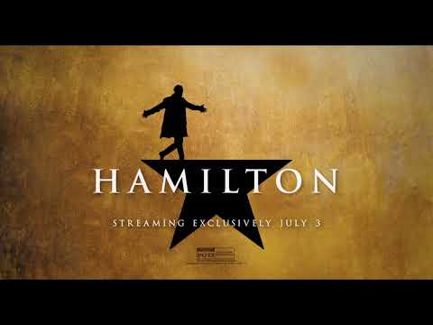 Hamilton trailer close-up of performers mid-song under stage lights