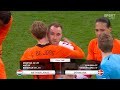 The Dutch and Danish players embrace Christian Eriksen after his brilliant return for Denmark.