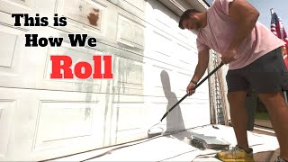 Garage door painting with a roller