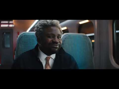 Bullet Train (2022) official trailer still of Brad Pitt as Ladybug walking through Tokyo Station