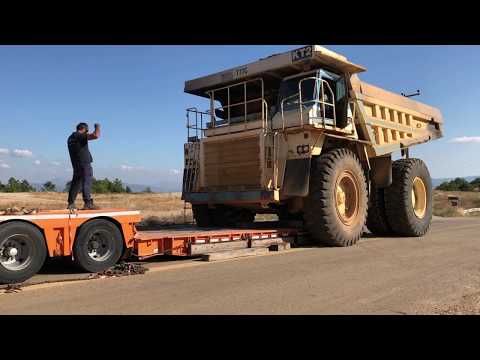 Loading The Caterpillar 777C Dumper - Poultidis Lifts And Transports