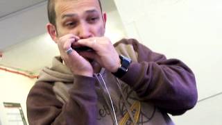 Dave jams on his harmonica