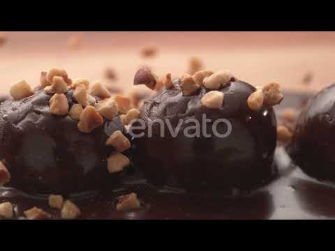 Nuts pouring onto chocolate truffles in super slow motion. Shot on Phantom Flex 4K high speed ca...