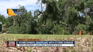 Strong winds damage property in Polk County
