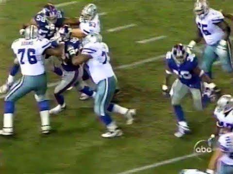 Larry Allen, Cowboys Guard, takes the defense where he wants to them go.