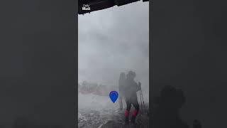 Tourists flee enormous avalanche
