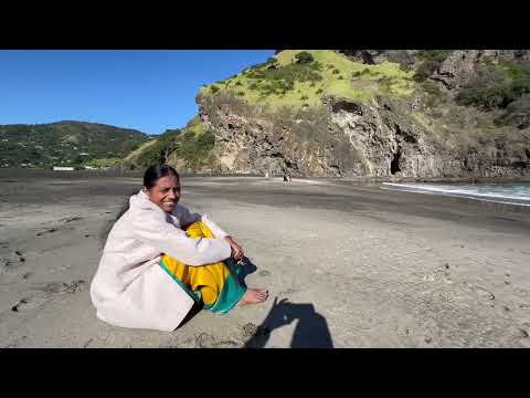 Gundu Playing in sand on Piha beach - Auckland June2023