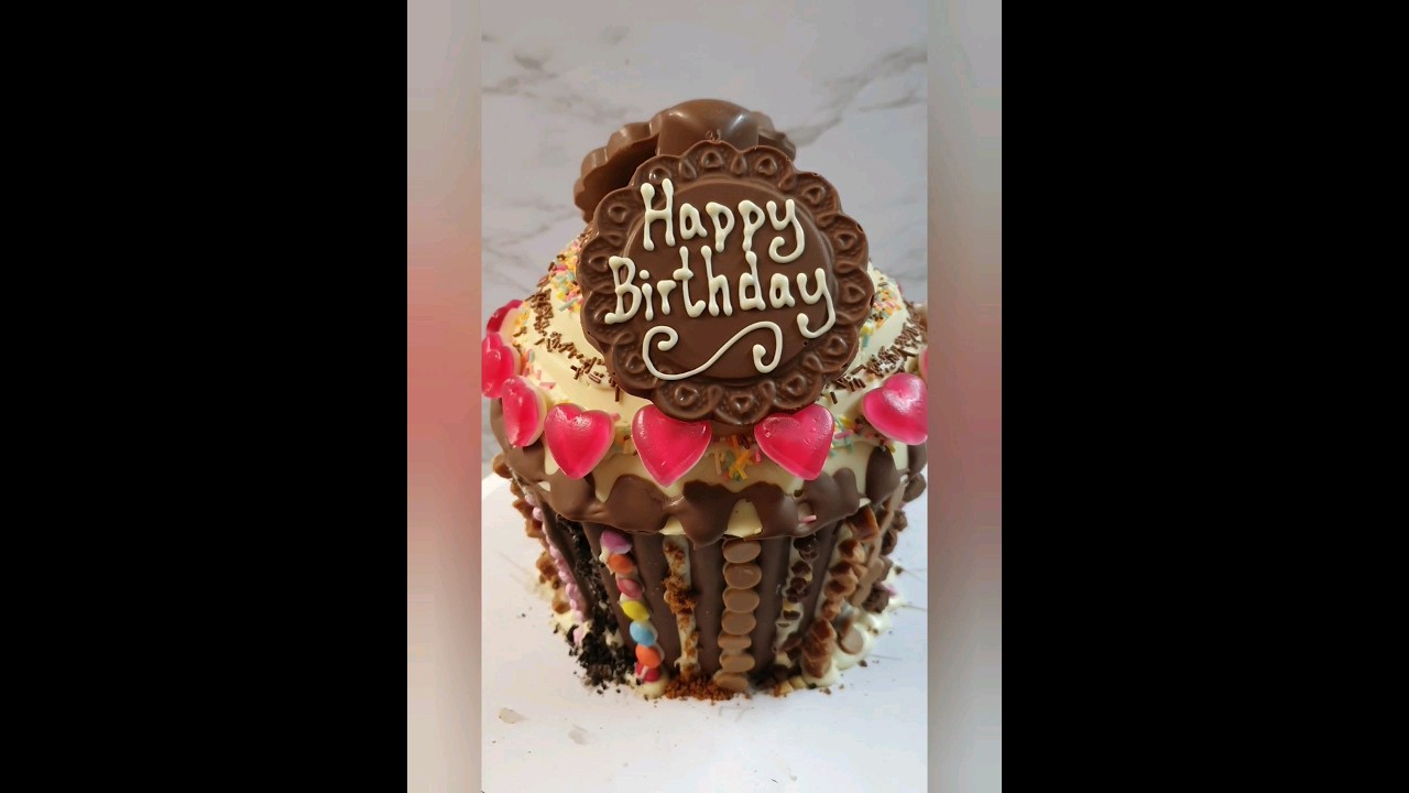 Quick video of me loading up a giant cupcake smash cake and decorating delicious chocolate treats!