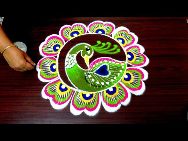 Beautiful peacock rangoli design by simple rangoli