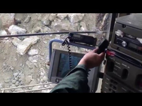 Terex RH170 Shovel Excavator Loading Huge Stones On Terex TR100 Dumper