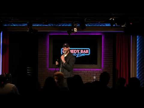 Comedian interacting with a South Asian audience member at Comedy Bar in Toronto during a show.