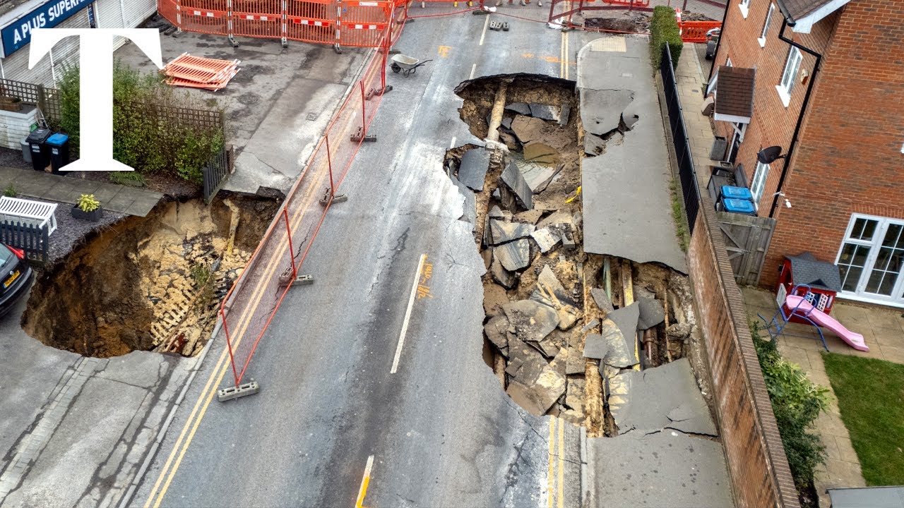 Two large sinkholes open up on Surrey high street