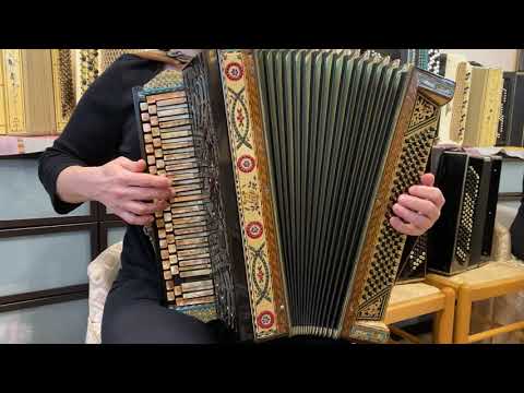 Demonstration of antique custom made bayan.