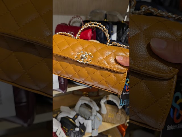 شنطة جلد أحمر غامق