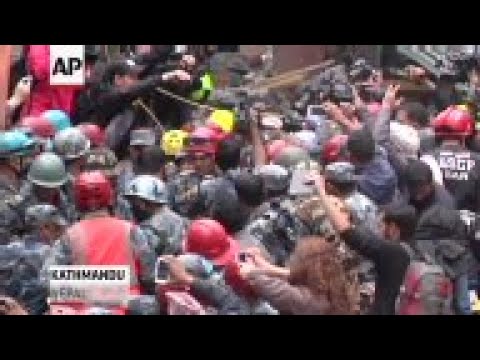 Rescuers in Kathmandu, Nepal pulled a teenage boy alive from the rubble of a collapsed building on T
