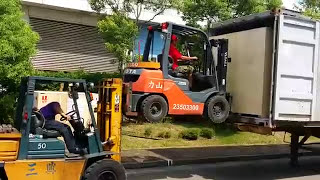 Movers Use Forklift to Lift Forklift
