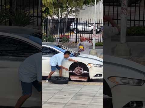 See how the car tyre was stolen in broad daylight.