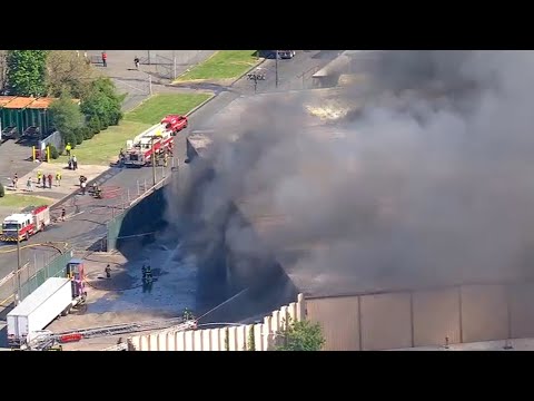 Heavy smoke spews from fire at waste management facility in NJ