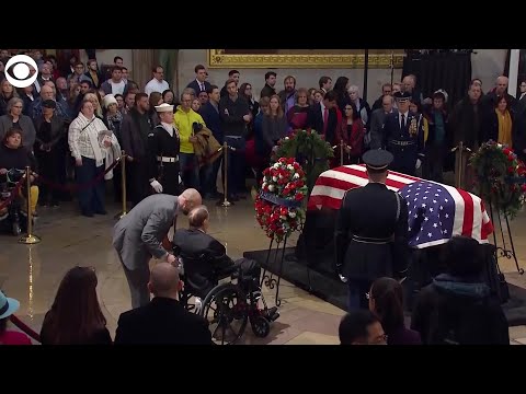 Bob Dole salutes President Bush