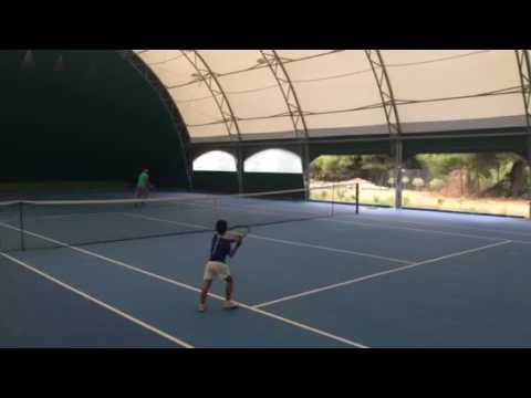 Rafael Pagonis playing tennis with dad at age 5