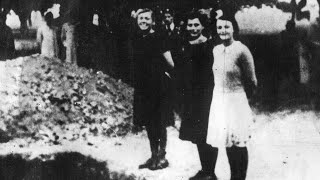 Teenage girls smile in front of their graves World War 2