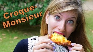Eating a Croque-monsieur grilled cheese sandwich in Paris, France