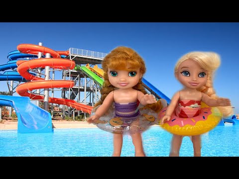 Pool day Elsa and Anna toddlers go on vacation swimming floats barbie doll