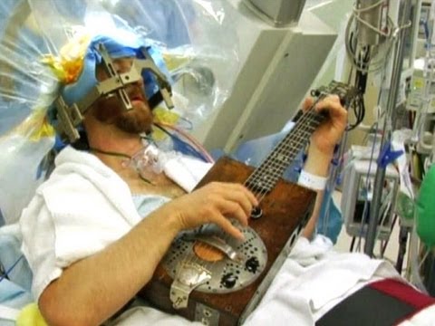 Man plays guitar during brain surgery