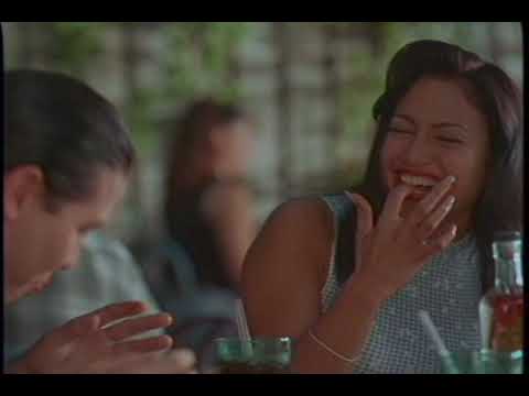 Official trailer still for Selena (1997) with Jennifer Lopez smiling on stage