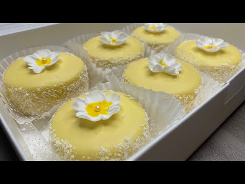 Small white chocolate and coconut cakes decorated with flowers
