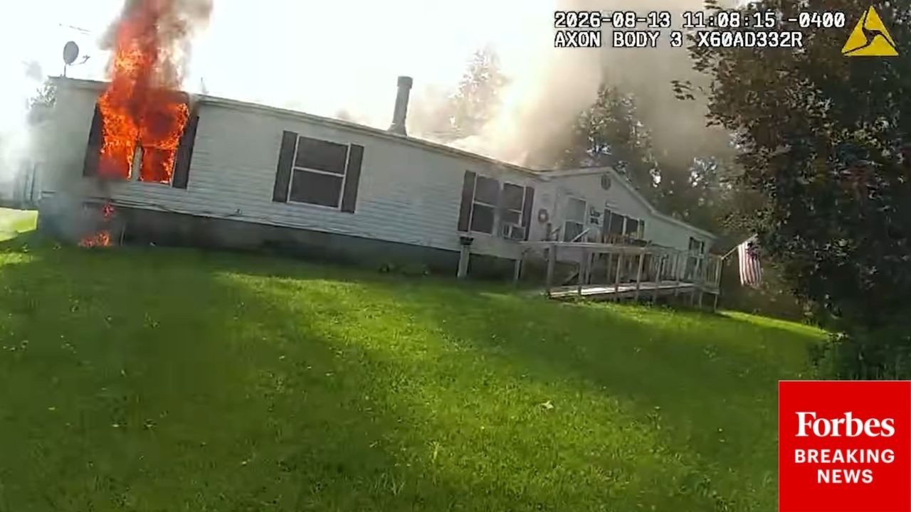 Video: New York State Troopers guide 80-year-old man from Oswegatchie burning home