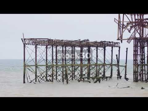 3 Close Up Shots Of Burnt Out Brighton Pier On Overcast Day, UK