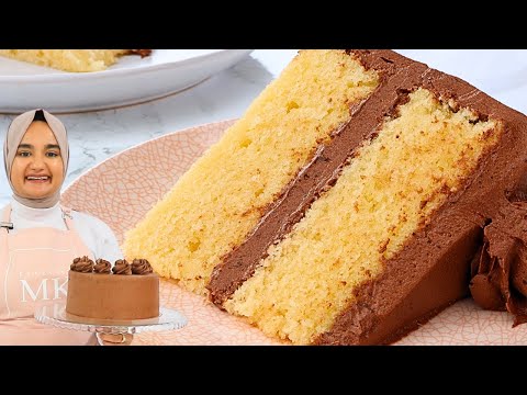 The most buttery, tender YELLOW CAKE I've ever had. With super creamy chocolate frosting!