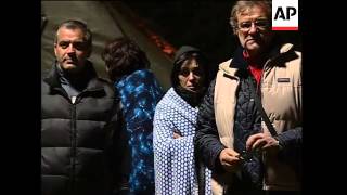Night scenes from quake- damaged area, tents, survivors
