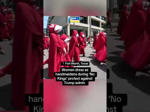 Protesters dress as handmaidens from the series “The Handmaid’s Tale” during a ‘No Kings’ protest.