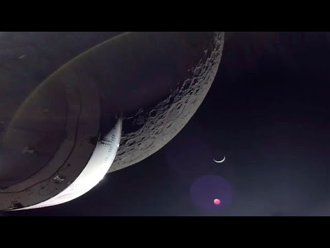 Orion space capsule approaches the moon to within 130 kilometers