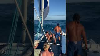 Women Sitting on Catamaran Net Gets Soaked by Tall Waves - 1496400