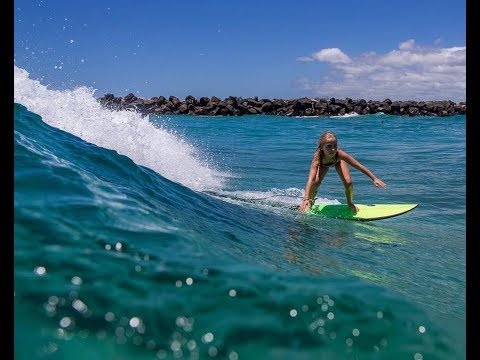 7 year old surfer girl Ilaria Craven surfs Dbah with Rip Curl rider Khi Williams