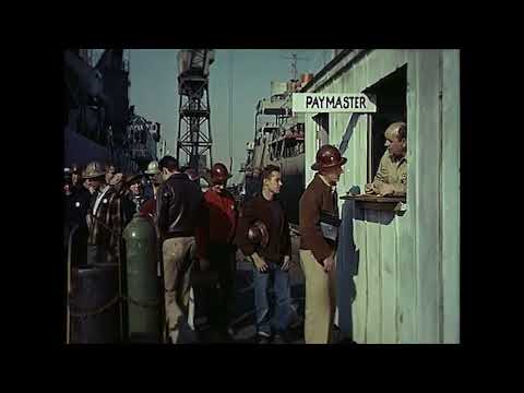 Trailer frame: spotlight on Danny Kaye with cornet; orchestra in soft focus
