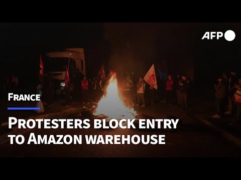 Protesters block entrance to Amazon warehouse in northern France | AFP
