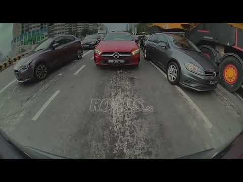 A vehicle in a heavy vehicle’s blind spot was hit and dragged, causing a multi-vehicle collision.