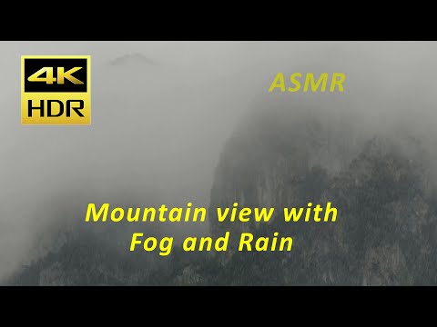 Foggy mountain with rain 4k