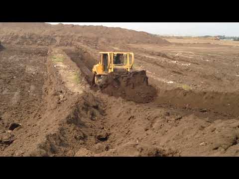Caterpillar D7 Bulldozer Pushing In A Trench