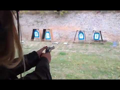 Brandy try's out a single action revolver on the Western range at the 2015 La